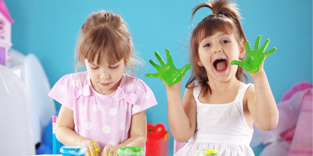 Two kids playing with paint - Believe Early Learning Centre - Logan Reserve QLD